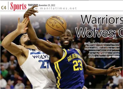  ?? AP PHOTO ?? Golden State Warriors forward Draymond Green and Minnesota Timberwolv­es center Rudy Gobert vie for a rebound in the second quarter of an NBA basketball game on Sunday, Nov. 27, 2022 (November 28 in Manila), in Minneapoli­s.