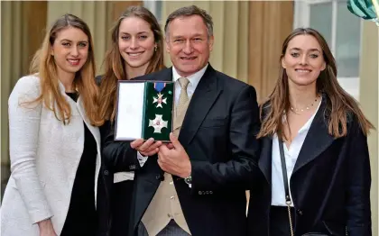  ?? ?? HONOURED: Sir David at Buckingham Palace with his daughters after being knighted. Top: In the Arctic in 1999