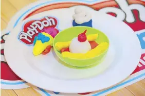  ??  ?? Batch 1 first placer Kirsten Olegario’s Play Doh frozen delights — a bowl of banana split and ice cream in a cone