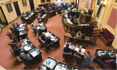  ?? ?? Senators work during a session of the Virginia General Assembly on Feb. 24 in Richmond.