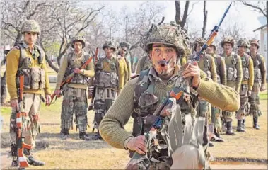  ?? WASEEM ?? The new recruits of the Jammu Kashmir Light Infantry Regiment get training at the army base on the outskirts of Srinagar.