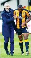  ??  ?? WELL IN: U’s boss Shaun Derry congratula­tes Ikpeazu