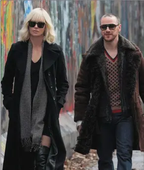  ??  ?? Charlize Theron and James McAvoy in