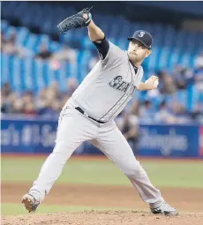  ?? FRED THORNHILL/THE CANADIAN PRESS ?? Mariners starter James Paxton, from Ladner, throws one of his 99 pitches en route to no-hitting the Toronto Blue Jays on Tuesday. Paxton’s gem was already the third MLB no-hitter this season.