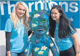  ??  ?? Oor Wullie got in on the act before the rain came bucketing down. He’s pictured with Morgan and Lauren Smith.