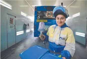  ?? Picture: DOMINIC O’BRIEN ?? FOLLOWING HER PASSION: Apprentice spray painter and panelbeate­r Dimitria Klokas enjoys combining her automotive interest with hands-on work.