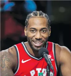  ?? ERNEST DOROSZUK ?? Kawhi Leonard speaks during Raptors Media Day in Toronto on Monday. He kept his thoughts on his past in San Antonio and pending free agency close to his vest, noting his focus is on this season.