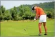  ?? TANIA BARRICKLO — DAILY FREEMAN ?? Becky Fall hits her ball onto the green during Friday’s first round of the Ulster Women’s Golf Associatio­n championsh­ip. She was six shots back in third place after Saturday’s second round of play.