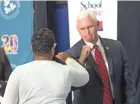  ?? MARK HOFFMAN / MILWAUKEE JOURNAL SENTINEL ?? Vice President Mike Pence greets Granville Lutheran School Principal Trenae Howard after sitting in on a school choice roundtable discussion at the Waukesha STEM Academy.