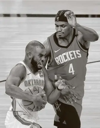  ?? Kevin C. Cox / Associated Press ?? Danuel House Jr. (4) was disappoint­ed by his first postseason appearance in 2019 but has emerged as a crucial role player for the Rockets in their first-round series against the Thunder.