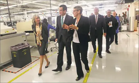  ?? Hearst Connecticu­t Media file photos ?? Former Gov. Dannel P. Malloy on a 2014 tour of Microboard Processing in Seymour, among some 1,900 companies to receive state financing under Malloy’s Small Business Express program.