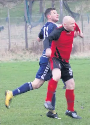  ??  ?? ●●Action from Heaton Mersey’s clash against Village (in blue)