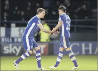  ?? PICTURE: STEVE ELLIS. ?? TOUGH GOING: Glenn Loovens tries to console Sheffield Wednesday team-mate Sam Hutchinson on Wednesday night.