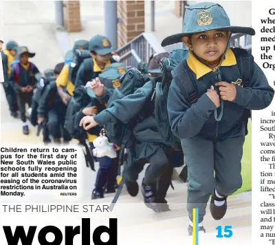  ?? REUTERS ?? Children return to campus for the first day of New South Wales public schools fully reopening for all students amid the easing of the coronaviru­s restrictio­ns in Australia on Monday.