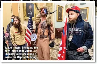  ?? ?? Jan. 6 rioters, including the now-imprisoned Jacob Chansley (center), made it inside the Capitol Building