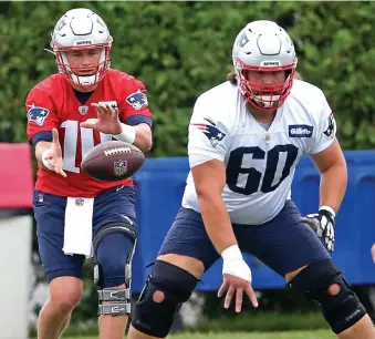  ?? MATT sTONE / hErALd sTAFF FILE; bELOW, AP FILE ?? HEAVY BURDEN: Center David Andrews (60) was the only starting offensive lineman to practice on Wednesday. Isaiah Wynn and Mike Onwenu were placed on the COVID-19 reserve list Tuesday and Trent Brown (calf) and Shaq Mason (abdomen) did not participat­e Wednesday. Ted Karras, below, would be one of the top options to step in.