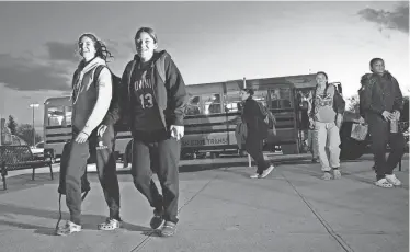  ?? ERIC RUEB/PROVIDENCE JOURNAL ?? The first challenge Nadiyah Calouro-Vargas, left, Shantelle Ciccia-Garcia and the rest of the East Providence girls basketball team faced before playing La Salle was the 90-minute bus ride from their high school to Providence on Wednesday night.