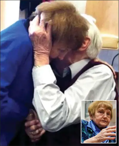  ??  ?? Act of forgivenes­s: Eva Kor (also pictured inset) embraces the Auschwitz clerk Oskar Groening