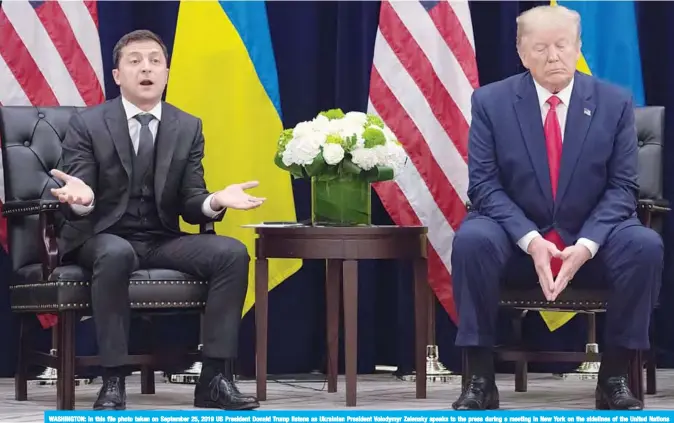  ?? —AFP ?? WASHINGTON: In this file photo taken on September 25, 2019 US President Donald Trump listens as Ukrainian President Volodymyr Zelensky speaks to the press during a meeting in New York on the sidelines of the United Nations General Assembly.