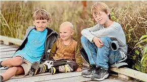  ?? ?? Daniel and Fran Huelsmeyer, far right, and their three children, – 2-year-old Jacob and 9-year-olds Anton and Emil – have a less chaotic life now the family has a live-in helper.