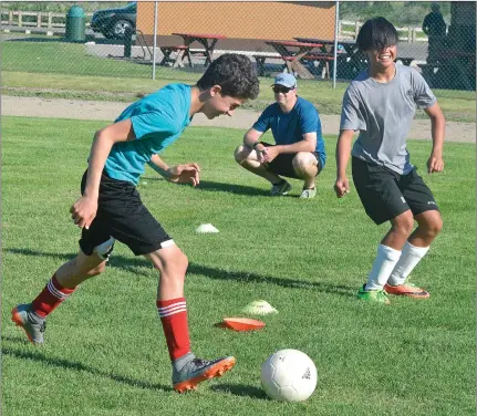  ?? SCOTT ANDERSON/SOUTHWEST BOOSTER FILE PHOTO ?? Chad Striker (centre) was named one of eight 2020 Canada Soccer Nation Champions for his work to bring soccer back in Swift Current last year.