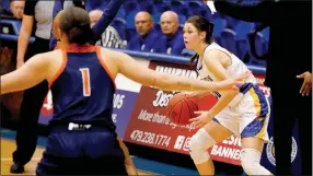  ?? Photo courtesy of JBU Sports Informatio­n ?? John Brown sophomore guard Natalie Smith looks to make a play against Langston on Dec. 3. The Golden Eagles are back in action on Thursday at Mid-America Christian before returning home on Saturday against Southweste­rn Christian (Okla.).