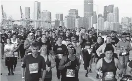  ?? CARL JUSTE cjuste@miamiheral­d.com ?? The Life Time Miami Marathon and Half Marathon, which usually has more than 20,000 participan­ts, will be limited to 15,000 in 2022.