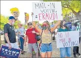  ??  ?? A protest in Nevada against mail-in voting. President Trump is now encouragin­g voters in the swing state of Florida to vote by mail.