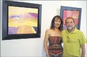  ?? (Photo P. Ma. ?? Sylvie Duhon, directrice de la galerie, et Jean-Pierre Maltese devant deux de ses toiles colorées.