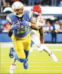  ?? ?? CHARGERS RECEIVER Keenan Allen, outmaneuve­ring the Chiefs’ Joshua Williams, had five catches in his return to action.