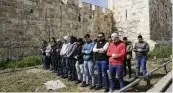  ?? MAHMOUD ILLEAN / AP ?? Palestinia­n Muslims pray outside of the walls of the Old City of Jerusalem after Israeli police denied their entry to the Al-Aqsa Mosque compound for Friday prayers on Friday.