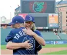  ?? AP PHOTO/JULIO CORTEZ ?? Tampa Bay Rays pitchers Ryan Yarbrough (48) and Ryne Stanek embrace Sunday after giving an interview after their game against the Baltimore Orioles.