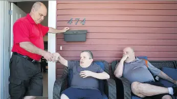  ?? KAYLE NEIS ?? Jay (left) and Ari Avivi (right) hang out with their brother David (centre) during a visit at the Evergreen care home where David now lives in Saskatoon. David was previously a longtime resident of Valley View.