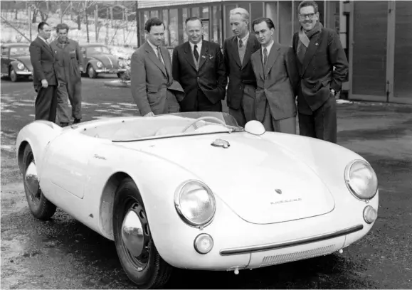  ??  ?? BELOW The fruits of Fuhrmann’s first stint at Porsche included the 550 Spyder, seen here in 1954 alongside Ferry Porsche, Wilhelm Hild, Von Hanstein and Fuhrmann himself