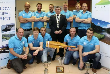  ??  ?? Cllr John Snell with members of the Vartry Rowing Club, who won the Celtic Challenge earlier this year.
