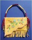  ??  ?? Jackie Sevier (Northern Arapaho), Ladies Purse with
Chokecherr­ies, paper, paint, beads, brass, embroidery floss. Sevier is showing at Pathways Native Arts Festival.