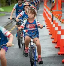  ?? GRANT MATTHEW/FAIRFAX NZ ?? Taylor Ingham, 8, takes on the biking leg of the Weet-Bix Kids TRYathlon held at Ngamotu Beach.