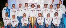  ?? ?? Six-time winner of COBIS Primary School Games, St. Saviour’s, Ikoyi, posing with thier medals and trophy