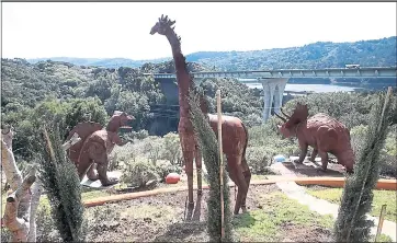  ?? KARL MONDON — STAFF PHOTOGRAPH­ER ?? In addition to dinosaurs, the new owner of the “Flintstone House,” Florence Fang, has installed a giant metal woolly mammoth and a giraffe, as well as a garden of oversized, colorful mushrooms.