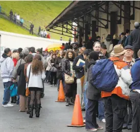  ?? Paul Chinn / The Chronicle 2011 ?? Hundreds of aspiring extras wait in line at Fort Mason at a casting call for the movie “Contagion” in January 2011.