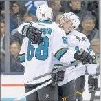  ?? NATHAN DENETTE/ASSOCIATED PRESS ?? Melker Karlsson (68) is congratula­ted by Joe Pavelski after Karlsson’s second-period goal.