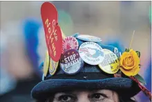  ?? ALASTAIR GRANT THE ASSOCIATED PRESS ?? An anti-Brexit demonstrat­or protests outside U.K. Parliament Thursday as MPs defeated a motion to support Theresa May’s Brexit strategy.