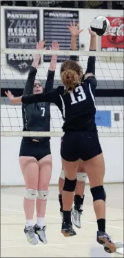  ??  ?? Ridgeland’s Jayda Jenkins goes up for a kill as Gordon Lee’s Mallory Collier (left) looks to assist on defense. (Messenger photo/Scott Herpst)