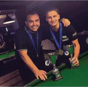  ??  ?? Runcorn Cricket Club vice-captain David McNamara ( left) celebrates becoming the U23 world pool champion. He is pictured with Ben Rowland who won the equivalent title in the U18 category.