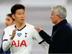  ?? (Getty) ?? Mourinho embraces Son after victory over Everton