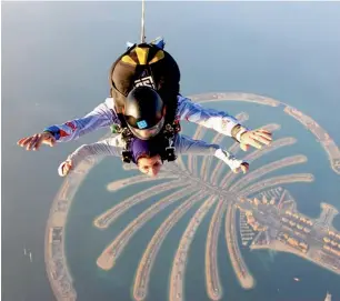 ??  ?? Fatima Jassim during a skydive over the Palm in Dubai. She say ‘the view was worth every second’.