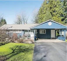  ??  ?? The updated rancher-plus-basement family home at 1731 Harbour Dr. backs on to Selkirk Park in Coquitlam’s Harbour Chines neighbourh­ood.