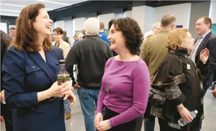  ?? ANTONIO PEREZ/CHICAGO TRIBUNE ?? Cook County state’s attorney Democratic Party nominee Eileen O’Neill Burke, left, chats with Ald. Debra Silverstei­n and supporters on Monday at the Plumbers Local 130 UA Training Center in Chicago.