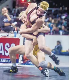  ?? ROBERTO E. ROSALES/JOURNAL ?? Belen’s Rowdy Robinson, right, tries to push away from St. Pius’ Diego Pavia during their 160-pound state 5A finals match last Saturday. Robinson won by a 3-2 decision.