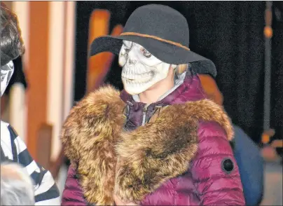  ?? DESIREE ANSTEY/JOURNAL PIONEER ?? Colby Arsenault has guests puzzled as they attempt to identify her under the mask and disguise of Mi-Carême.